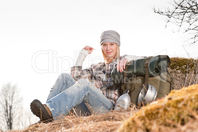 Camping young woman in countryside backpack