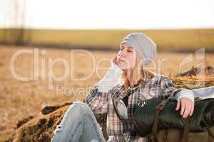 Camping young woman in countryside backpack relax