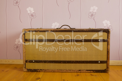 Suitcase on wooden floor