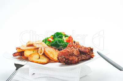 Fried potatoes broccoli carrots and roasted chicken