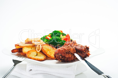 Fried potatoes broccoli carrots and roasted chicken