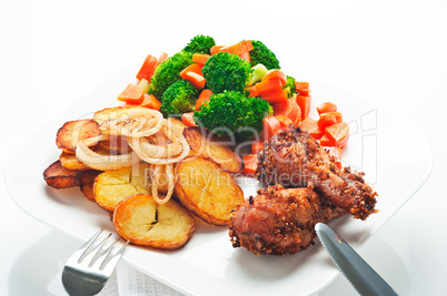 Fried potatoes broccoli carrots and roasted chicken