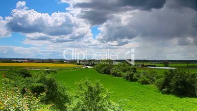 Sun and Cloudy sky before storm over landscape10sec