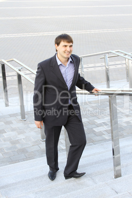 Businessman climbing stairs