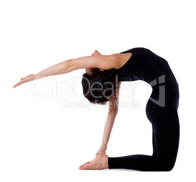 woman back bends yoga - camel pose with hand