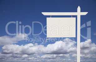 Blank White Real Estate Sign Over Sky and Clouds