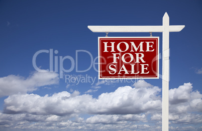 Red Home For Sale Real Estate Sign Over Clouds and Sky