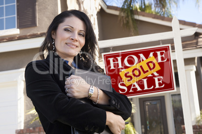 Hispanic Woman in Front of Real Estate Sign and New Home