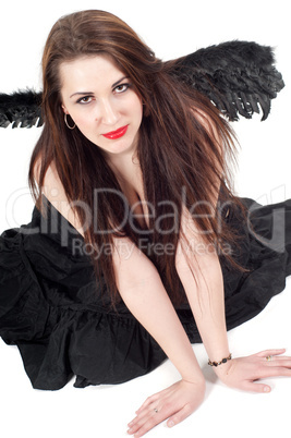 Beautiful brunette woman with black wings