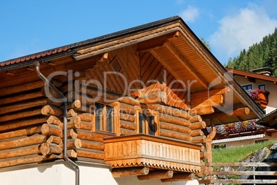 Wooden Alpine chalet with a balcony