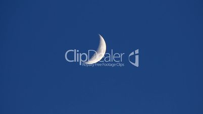 Moon movement in dark evening blue sky - time-lapse