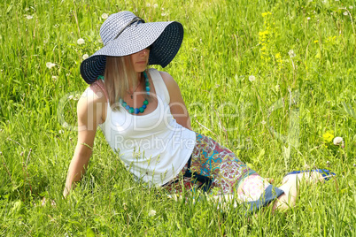 blonde girl in hat and spectacles