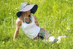 blonde girl in hat and spectacles