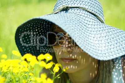 girl in hat and spectacles