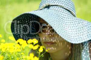 girl in hat and spectacles