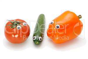 Funny tomato, cucumber and bellpepper with eyes on white background