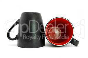 Two black coffe cups down and on side isolated