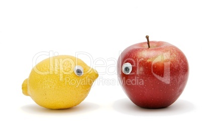 Funny lemon and apple with eyes isolated