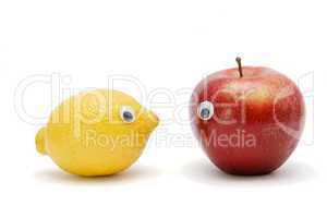 Funny lemon and apple with eyes isolated