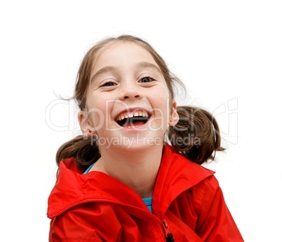 Laughing seven years girl with pigtails