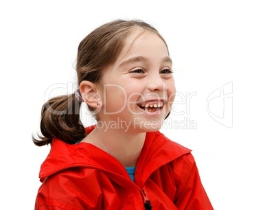 Laughing seven years girl with pigtails