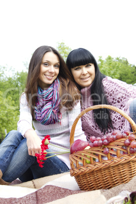 Mother and daughter relaxing outdoors