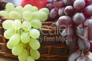 Red and white grape branch in a basket