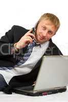 The businessman with phone and laptop