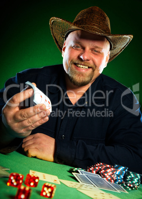 man with a beard plays poker