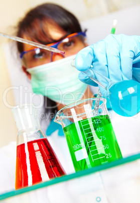 scientist in laboratory with test tubes