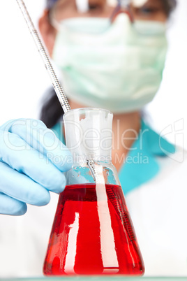 scientist in laboratory with test tubes