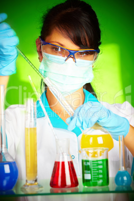 scientist in laboratory with test tubes