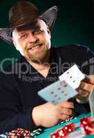 man with a beard plays poker