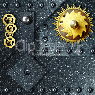 Gold gears against ferrous metal