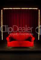 red sofa on the stage