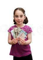 Smiling seven years girl with pigtails holds a fan of banknotes