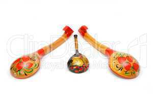 Three wooden Russian hand-painted spoons on white background