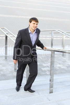 Businessman climbing stairs