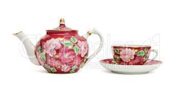 Old-fashioned floral-painted tea service isolated