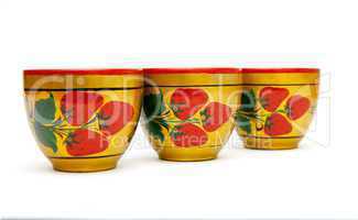 Three painted Russian khokhloma cups  isolated