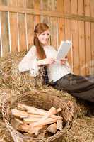 Young romantic woman read book in barn