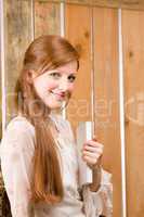 Young romantic woman hold book in barn