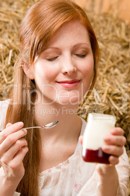 Young healthy woman with natural yogurt country