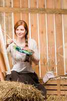 Red-hair romantic woman painting in barn country