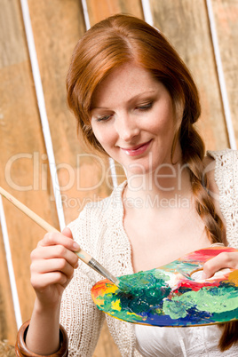 Young romantic woman hold color palette barn