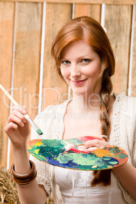 Young romantic woman hold color palette barn