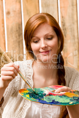 Young romantic woman hold color palette barn