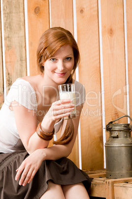 Young woman drink natural milk in barn