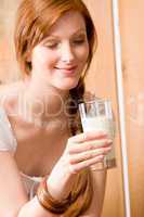Young woman drink glass of natural milk