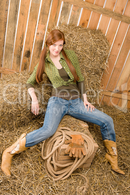 Provocative position young cowgirl on hay